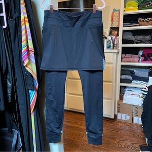 Athleta leggings skirted with reflective details, lined for warmth, size Medium.